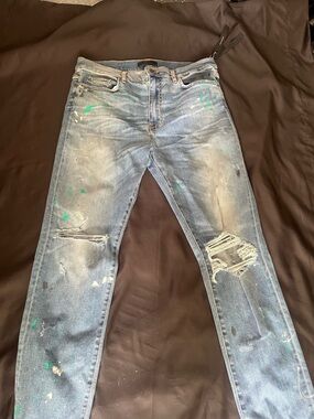 AMIRI Blue Skinny Jeans with Green Paint Accents